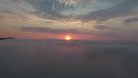 Aerial-drone-flight-above-clouds-during-sunrise.-Location-South-of-France.